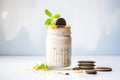 oreo milkshake with cookie crumbles, whole oreos on plate Royalty Free Stock Photo