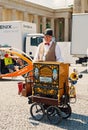 Organ grinder, man, with musical box in city Royalty Free Stock Photo