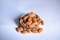 Organic Almond Nuts in a Transparent Glass Bowl On isolated White Background Royalty Free Stock Photo