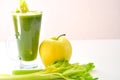 Organic apple and celery juice on a white background