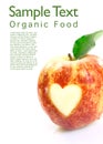 Organic apple with heart cutout Royalty Free Stock Photo