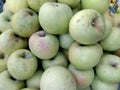 Close up view of fresh organic greenish apples arraged in fruit basket Royalty Free Stock Photo