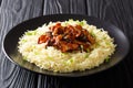 Organic Asian food glazed shiitake mushrooms with sesame seeds served with rice closeup on a plate. horizontal Royalty Free Stock Photo