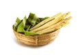 Organic asparagus spears, fresh crop in a basket with a green to Royalty Free Stock Photo