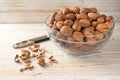 Organic autumn walnuts in a bowl, whole and cracked, healthy brain food with vitamins, unsaturated fatty acids and antioxidants, Royalty Free Stock Photo