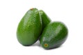 Organic avocado on white background. Healthy food. Tropical fruits. Three fresh and whole avocados, close-up.