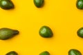 Organic avocados whole fruit on yellow table background.Healthy super foods for diet.Fresh vegetable from farm.keto food Royalty Free Stock Photo