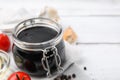 Organic balsamic vinegar and cooking ingredients on white table, closeup. Space for text Royalty Free Stock Photo