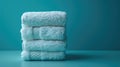 organic bamboo fiber washcloths stacked on blue color background, showcasing sustainable bathing alternatives