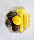 Organic banana avocado lemon bowl flat lay