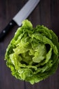 Organic beijing cabbage and knife on a wooden table. Top view