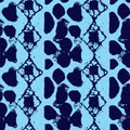Abstract indigo blue batik dye seamless pattern, Organic bleed effect dyed wash background. Royalty Free Stock Photo