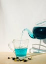 Organic Blue Anchan Tea in a glass teapot and cup. one cup and teapot butterfly pea flower blue tea Healthy Detox Herbal drink. Royalty Free Stock Photo