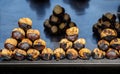 Organic brown chestnuts roasted over a hot fire for sale