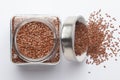 Organic Brown flaxseeds Linum usitatissimum or linseed in a glass jar with Lid