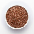 Organic Brown flaxseeds Linum usitatissimum or linseed in a white ceramic bowl