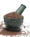 Organic Brown Mustard (Brassica juncea) on marble pestle.