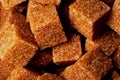 Organic brown sugar cubes macro background. Demerara sugar cubes Royalty Free Stock Photo