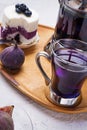 Organic Butterfly pea, clitoria or Blue pea flower herbal tea. Thai blue tea. served with lemon, fresh figs and blueberry cake on Royalty Free Stock Photo