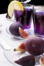 Organic Butterfly pea, clitoria or Blue pea flower herbal tea. Thai blue tea. served with lemon and fresh figs. close up Royalty Free Stock Photo