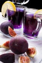 Organic Butterfly pea, clitoria or Blue pea flower herbal tea. Thai blue tea. served with lemon and fresh figs. close up Royalty Free Stock Photo