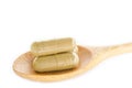 Organic capsule. Herb medical in wooden spoon.