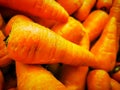 Organic carrots for sale. Fresh organic carrots at the farmers market. Royalty Free Stock Photo