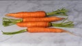 Organic carrots on white marble