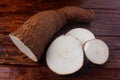 Organic cassava mandioca, aipim, brazilian cuisine, fresh and raw on rustic wooden table