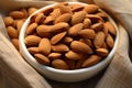 Organic charm almonds on an eco canvas napkin, health conscious display