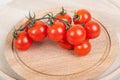 Organic cherry tomatoes on wooden table Royalty Free Stock Photo