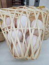 organic chicken eggs in bamboo basket Royalty Free Stock Photo