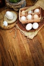 Organic chicken eggs in egg box against old style wooden background Royalty Free Stock Photo