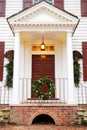 An organic Christmas wreath on a historic home