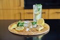 Organic cocktail drink with sparkling water lemon mint leaves ginger and ice Royalty Free Stock Photo