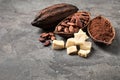 Organic cocoa butter, beans and powder on table Royalty Free Stock Photo