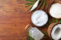 Organic coconut products for spa treatment, cosmetic or food ingredients. Oil, water and shavings on wooden table top view. Royalty Free Stock Photo