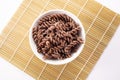 Organic cooked Buckwheat Fusilli pasta on white background. Wholegrain gluten free noodles. Healthy food concept