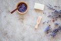 Cosmetic set with lavender herbs and sea salt in bottle on stone table background flat lay mockup Royalty Free Stock Photo