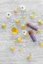 Organic cosmetics with camomile on wooden background top view Royalty Free Stock Photo