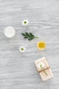 Organic cosmetics with camomile on wooden background top view Royalty Free Stock Photo