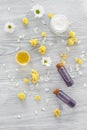Organic cosmetics with camomile on wooden background top view Royalty Free Stock Photo