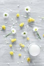 Organic cosmetics with camomile on wooden background top view Royalty Free Stock Photo