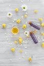 Organic cosmetics with camomile on wooden background top view Royalty Free Stock Photo