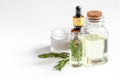 Organic cosmetics with extracts of herbs rosemary on white background