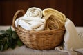 organic cotton textiles folded in a wicker basket