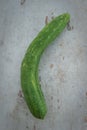 Organic cucumber on a wooden board