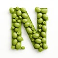 Organic 3d Cartoon Letter N Made Of Peas - Innovative Food Sculpting