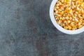 Organic Delicious Yellow Popcorn Kernels In White Bowl Royalty Free Stock Photo