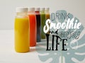 organic detox smoothies in bottles standing in row, drink smoothie and enjoy